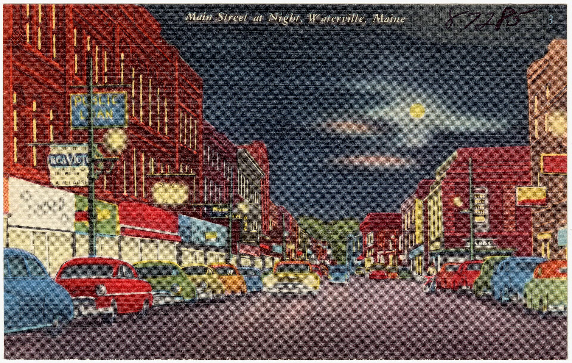 Main Street, Waterville, at night, on a linen postcard from the 1930s or 40s: lit storefronts, parked cars and a full moon